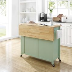 a kitchen island with a cutting board on it