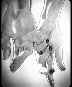 two hands holding each other with black and white ink on paper in front of them