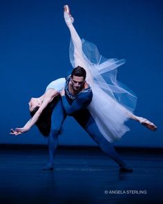 two ballerinas in tutu and leorboam pose for the camera