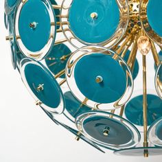 a blue and gold chandelier hanging from a ceiling