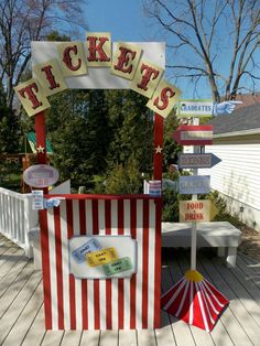 a carnival booth with tickets on it and a sign that says, ticket's