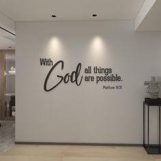 a white wall with black lettering that says, with all things are possible