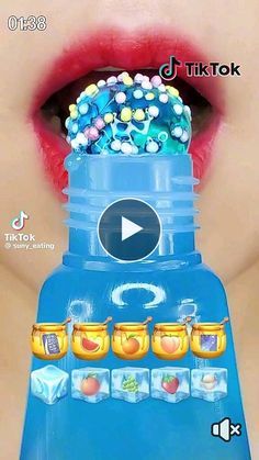 a woman's lips are shown with candy on top of the gummy machine