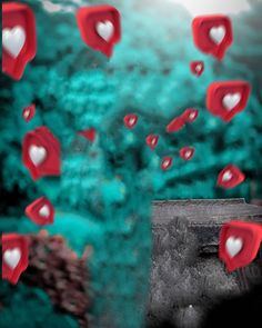 red and white hearts floating in the air over a green background with trees behind it