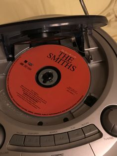 the smiths cd player with an orange disc