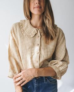 Soft checked linen button down blouse with a  feminine ruffle collar and gathered sleeves.    ethically made in portugal    model is wearing the size small Knit Cardi, Feminine Blouses, Gathered Sleeves, A Perfect Circle, Ruffle Collar, Button Down Blouse, Lifestyle Shop, Designer Outfits Woman, Vintage Shops