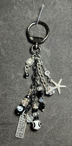 a close up of a key chain with charms