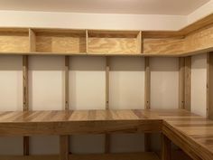 empty wooden shelves in the corner of a room