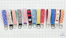 six different colored lanyards are lined up on a white background with the words hello kitty printed on them