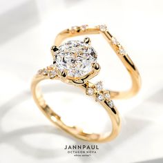 a gold ring with an oval cut diamond surrounded by small round diamonds on the band