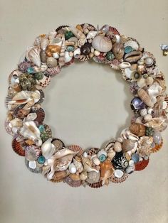 Prosperity Seashell Wreath-Nautical Decor and Gifts Seashells Diy Ideas, Sea Shells Diy, Seashell Wreath, Shell Wreath, Shells Diy, Seashell Ornaments, Beach Wreath, Surfboard Art, Sea Snail