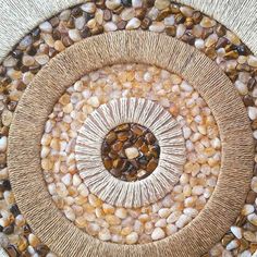 a circular design made out of rocks and pebbles