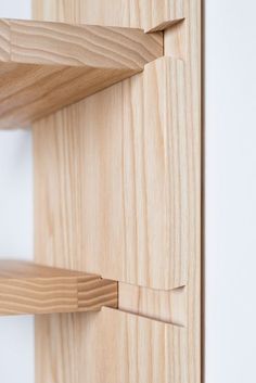 a wooden shelf with two pieces of wood on it