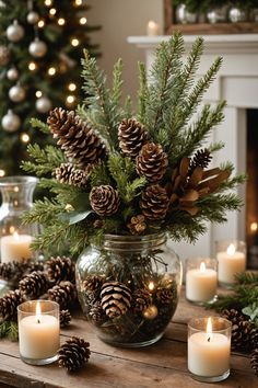 candles and pine cones in a glass jar on a table