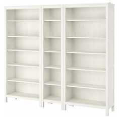 two white bookcases side by side, one is empty and the other has no doors