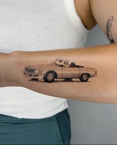 a woman's arm with a drawing of a car on it