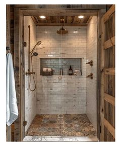 a walk in shower sitting inside of a bathroom