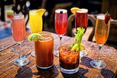 four different types of drinks on a table