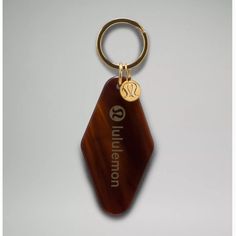 Nwt Lululemon Diamond Shaped Hotel Keychain In Black/Roasted Brown/ Gold Hotel Keychain, Black Leg Warmers, Vintage Keychain, New Car Accessories, Purple Headbands, Card Pouch, Vacation Mode, Gold Branding, Diamond Shaped