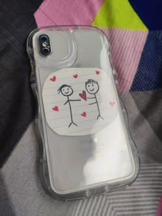 an iphone case with a drawing of two people holding hands and hearts on the back