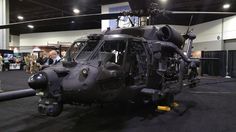 an army helicopter is on display at the convention