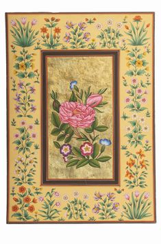 a painting with pink flowers and green leaves in a frame on a yellow wallpaper