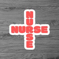 a sticker with the words nurse and a cross in red on a wooden background