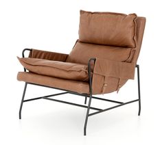 a brown leather chair sitting on top of a metal frame with a pillow in the back