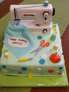 a birthday cake with a sewing machine on it