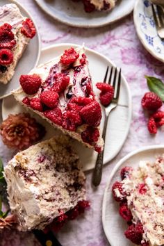 raspberry cheesecake on white plates with fork