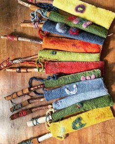 several different colored umbrellas are lined up on a table