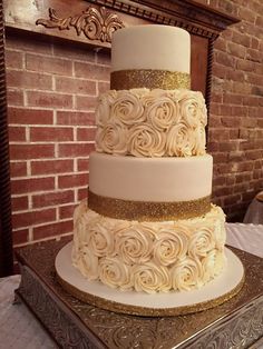 a three tiered wedding cake with gold decorations on it's sides and the words 25 best ideas about gold wedding