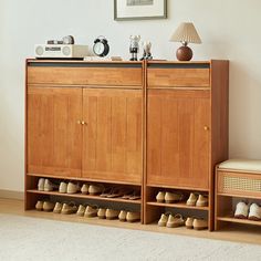 a wooden cabinet sitting next to a white rug