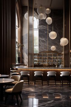 an elegant restaurant with marble flooring and hanging lights above the bar area, along with white chairs