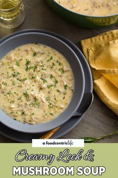 a bowl of creamed chicken and mushroom soup on a wooden table next to a yellow napkin