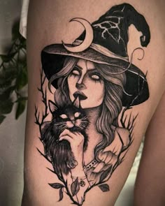 a woman wearing a witches hat and holding a cat on her thigh with leaves around her