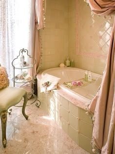 a bath room with a tub a chair and a window in it's corner