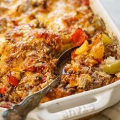 a casserole dish with meat and vegetables in it, ready to be eaten