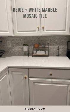 a kitchen with white cabinets and tile backsplash that says, beige + white marble mosaic tile