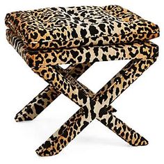 three leopard print stools stacked on top of each other