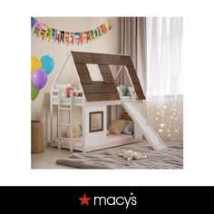 a kid's bedroom with a loft bed and slide