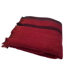 a red and black striped blanket on a white background