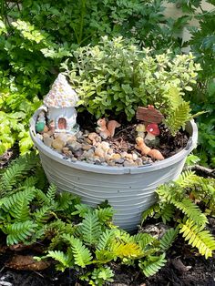 a potted planter filled with lots of plants