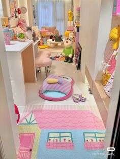 a room filled with lots of toys and decor in it's walls, including a rug that looks like a house