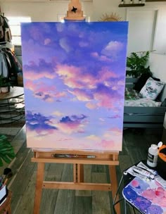 an easel with a painting on it in a room