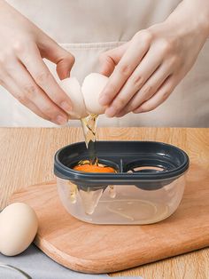 someone is peeling an egg into a bowl