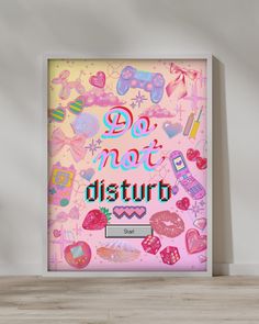 a pink poster with the words do not disturb on it in front of a white wall