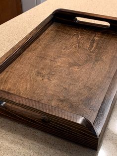 a wooden cutting board sitting on top of a counter