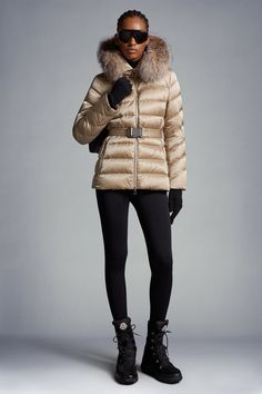 The Cupidone down jacket delivers a sophisticated winter look, showcasing a feminine silhouette accentuated by a belted waistline. Crafted from nylon satin, the hooded puffer jacket is finished with a luxurious fox fur trim. Luxury Puffer Jacket With Padded Collar, Luxury Puffer Jacket With Double-lined Hood, Luxury Mink Outerwear For Cold Weather, Luxury Mink-colored Outerwear For Cold Weather, Luxury Puffer Jacket With Faux Fur Lining, Luxury Outerwear With Faux Fur Lining, Luxury Hooded Outerwear With Faux Fur Lining, Luxury Fall Puffer Jacket With Double-lined Hood, Luxury Hooded Jacket With Double-lined Hood