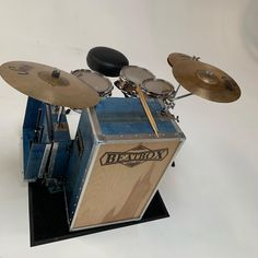 a drum set sitting on top of a black stand